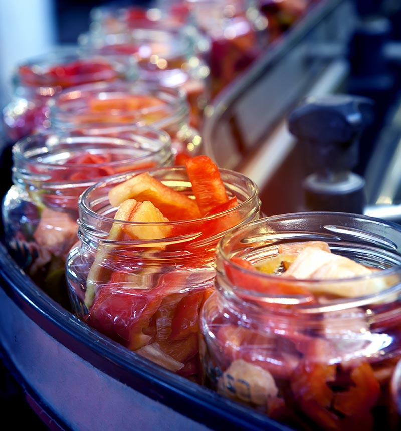 glass jars filled with canned food items