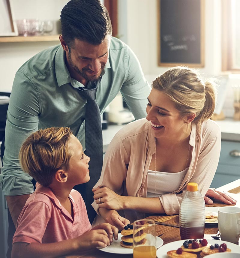 Family enjoying breakfast together in the kitchen
